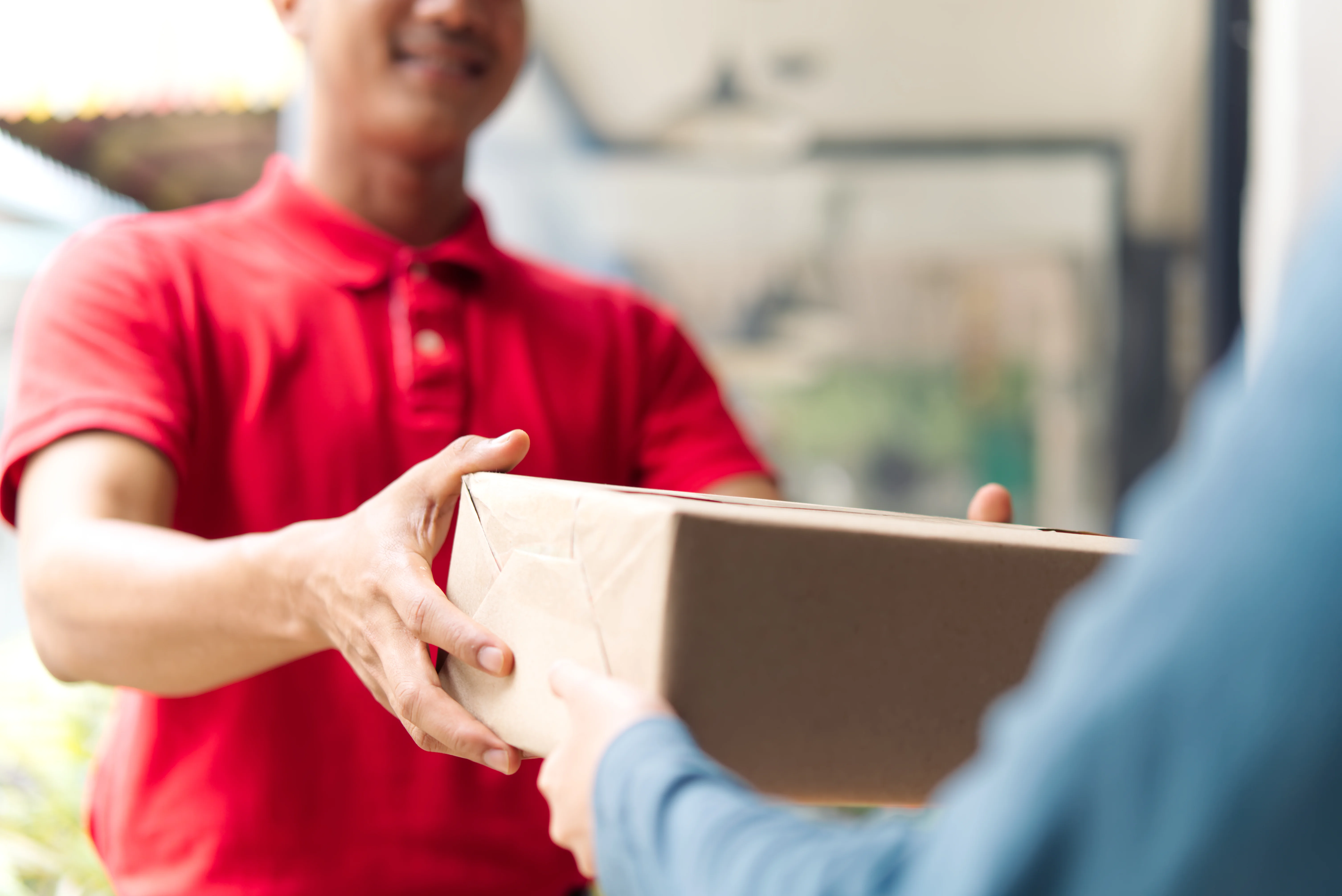 delivery-service-presents-package-to-person-2026-03-24-15-27-18-utc